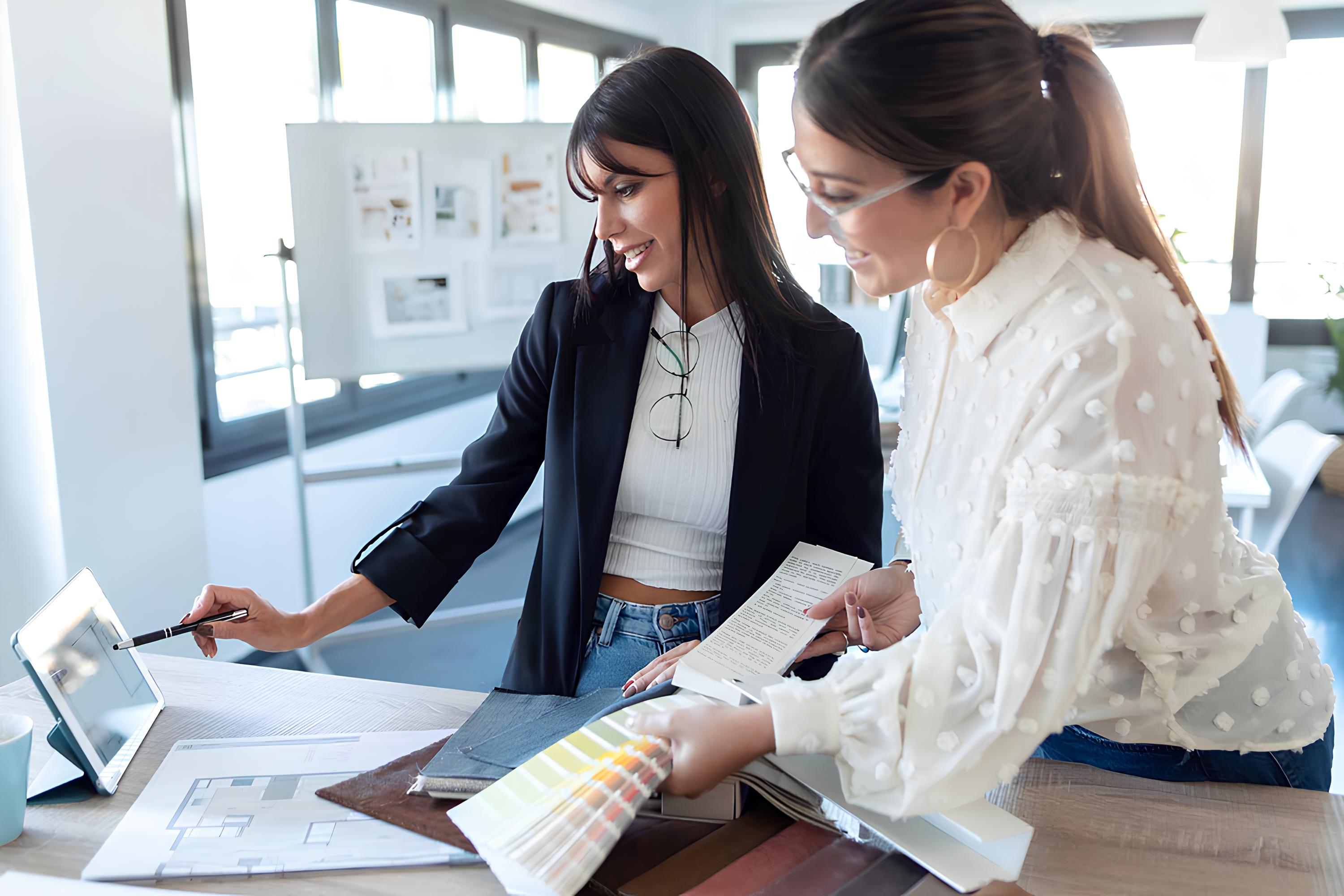 Women collaborating in modern office setting.