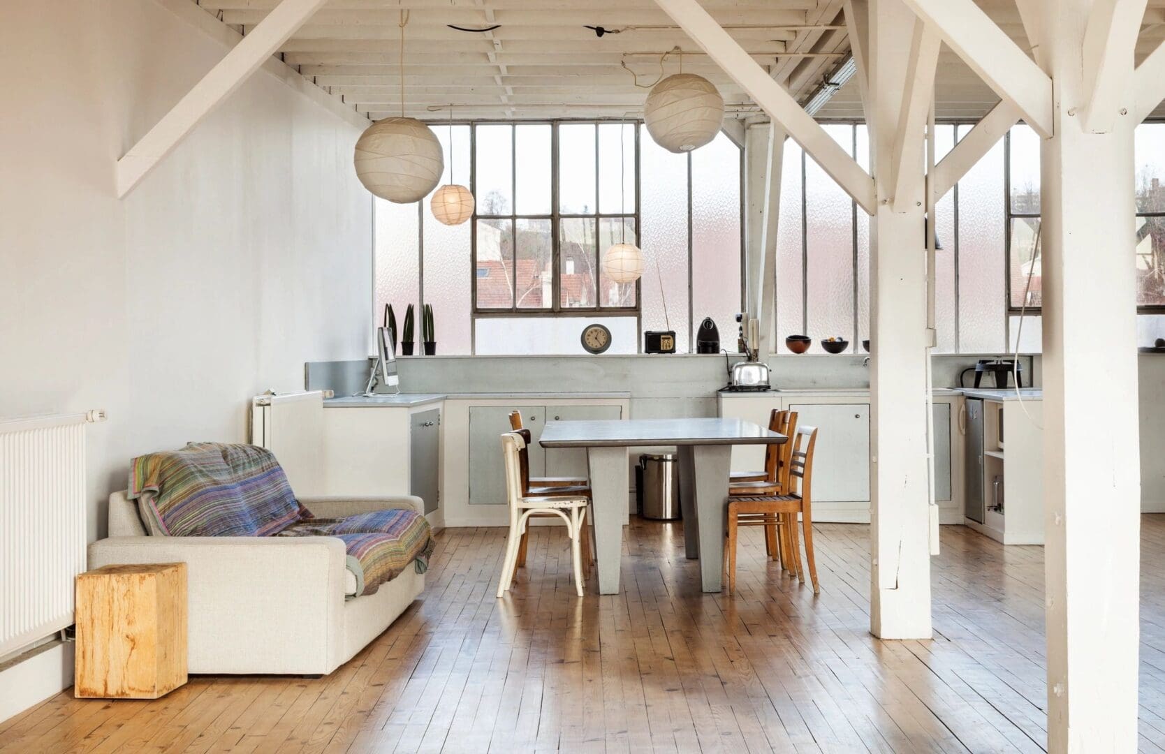 Loft kitchen with dining table and sofa.